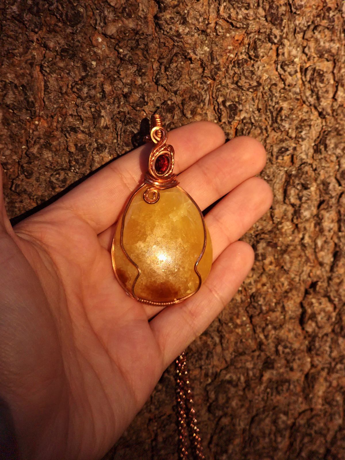 Yellow Septarian and faceted Ruby in a copper wrap