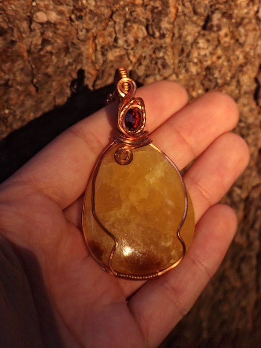 Yellow Septarian and faceted Ruby in a copper wrap